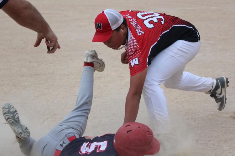 Ron Knudsen gets the out at third base.