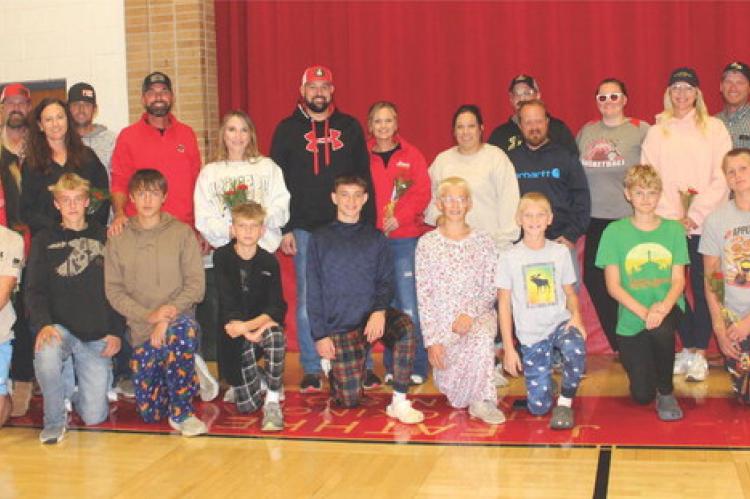 The Avon Pirate Cross Country team was recognized during last week’s Avon volleyball game as part of Parents’ Night. Pictured are, from left: Chad Cooper, Amy Tolsma, Jeff Tolsma, Teanna Kuhlman, Dan Kuhlman, Kenny Podzimek, Whitney Podzimek, Chris Fa