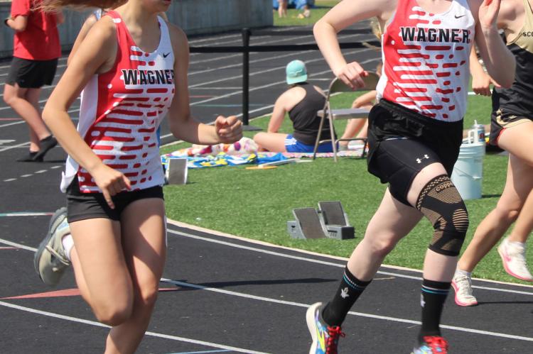 Taya Stone and Presley Slaba running the mile. Photo by Jan Martin