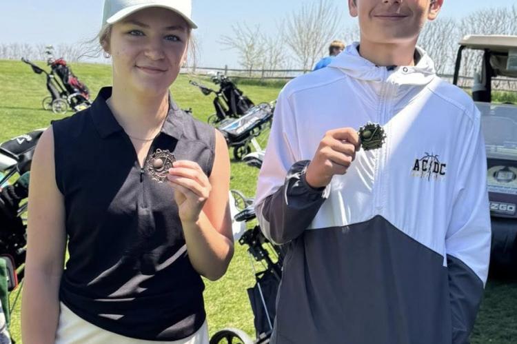 Madilyn and Lane with their 14th and 10th place medals. Courtesy Photos.
