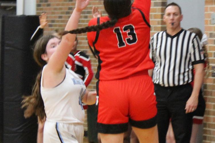 Genesis Patterson goes up for the basket. Photos by Chad Lau