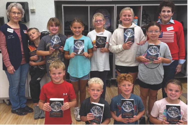 Pictured are, back row from left: Florence Powers (Auxiliary Treasurer,) Brandon Beeson, Esmae Griffith, Kennedy Doom, Lilyanna Odens, Hudsyn Tjeerdsma, Mary Hurd (Auxiliary President); front row: Bowen Beeson, Levi Paulsen, Braxton Schultz, Hadley Cihak.