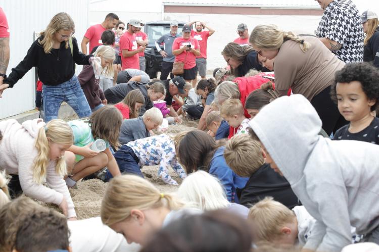 THROWBACK EVENT BRINGS SMILES WITH KIDS MONEY SAND PILE