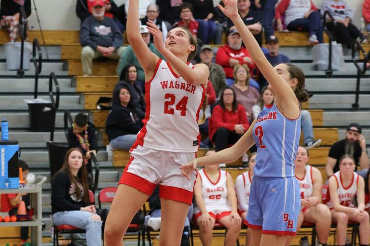 Ashlyn Koupal goes up for the basket.