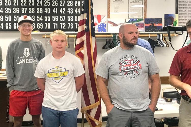 Pictured are, from left: Players Edward Ulrich, Frank Soukup, Landon Mudder, and Coaches Sam Metzger and Matt Slaba.
