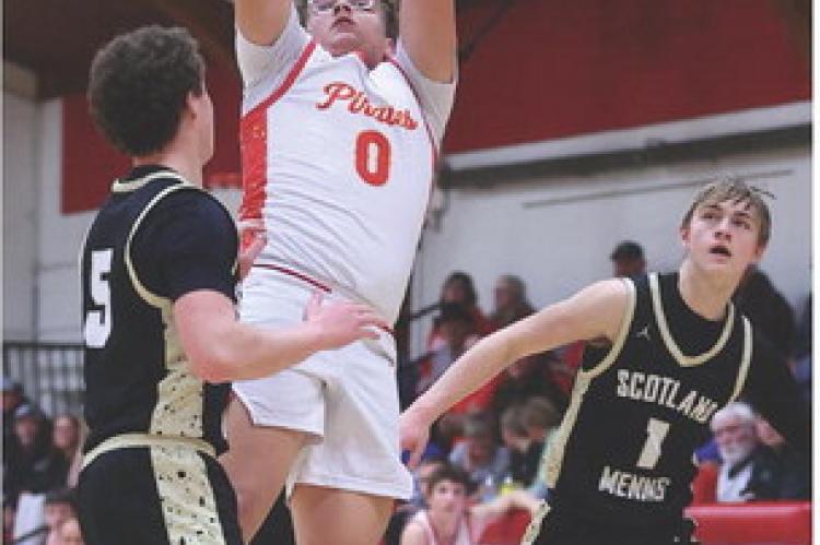 Dominic Doom rises above the Scotland/Menno defense for a two-point attempt during recent Pirate action.
