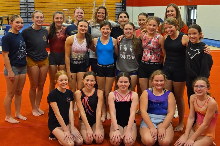 Gymnastics Team members are, back row from left: Dusti Laska, Amelia Rathgeberger, Roper Lhotak, Bella Kotab, Head Coach Cherie Petry, Hayden Wren, Aubry Williams, Assistant Coach CJ McNinch; middle row: Addison Cuka, Kamryn Krueger, Jayce Slade, Eva Frei
