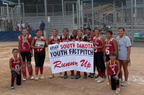 10U Players, pictured front row, from left are: Paige Drapeau and Jaylahni Drapeau; back row, from left: Lainey Martin, Shaymiah Brother of All, Harper Knudsen, Gabriella Weddell, Kimmimila Sully, Tamarie Bruguier, Shana Mousseaux, Amara Zephier, Tycara Tuttle, AnnaLeigh Sully, and Coach Keisha Bruguier.