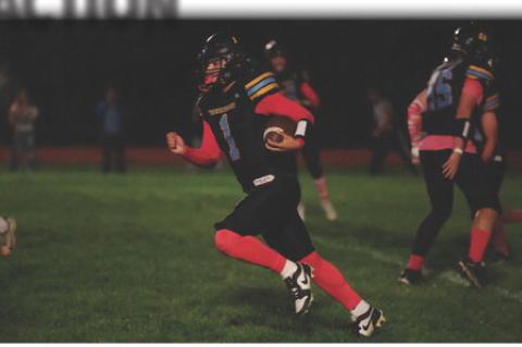 Thunder's Jamian Medicine Horn (#1) carries the football upfifield during Friday night's game against the Avon Pirates. PHOTOS BY BARB PECHOUS | PECHOUS.SMUGMUG.COM