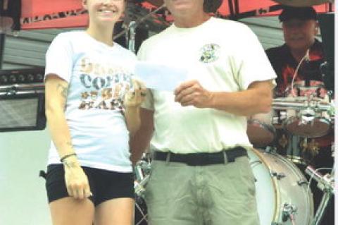 Board member Reese Powers granted funds to the City of Avon, accepted by Mayor Kevin Tjeerdsma. Courtesy Photo