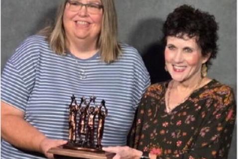 Loretta Knodel and Mary Hurd accepted the Community Helping Hands Award on behalf of the Avon School District and Avon Community Library. COURTESY PHOTO