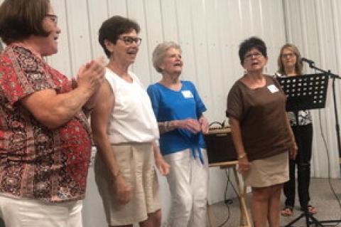 Leading the school song (On Ravinia) were: Karen Anderson, Linda Davies, Carol Kranig, Janet Hrdlicka-Lhotak.