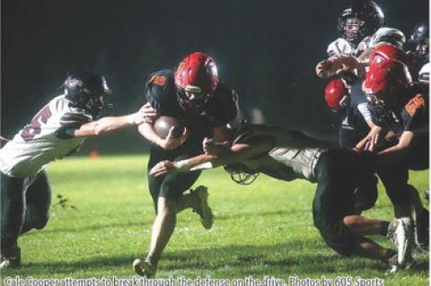 Cale Cooper attempts to break through the defense on the drive. Photos by 605 Sports