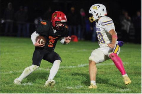 Avon Pirate #3 Cale Cooper looks to maneuver past a Centerville defender during the Pirates' regular-season fifinale. Cooper scored four rushing touchdowns in the victory.