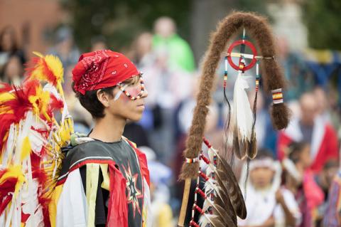 Brayden Thunder Shield, the 2026 Eagle Staff Carrier, prepares to enter the arena during St. Joseph’s Indian School’s 50th annual powwow. (Photo courtesy of St. Joseph’s Indian School)