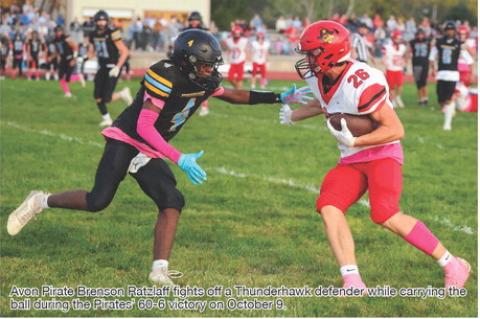 Avon Pirate Brenson Ratzlaffff fifights offff a Thunderhawk defender while carrying the ball during the Pirates' 60-6 victory on October 9.