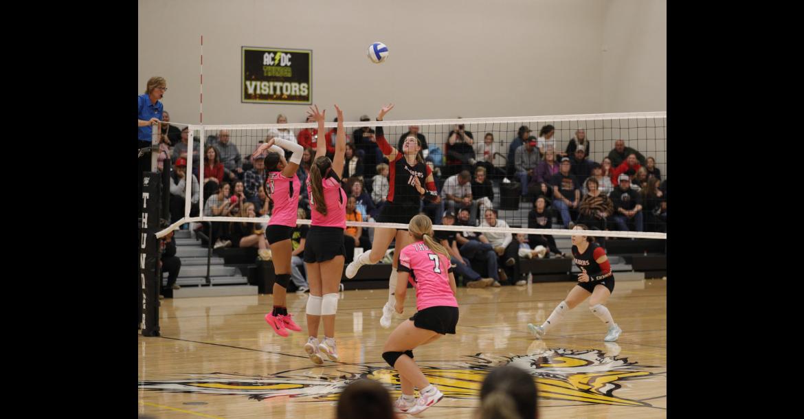 Wagner Lady Raider #16 Ravyn Medricky goes up at the net to make a play against two opposing blockers as her teammates prepare for the next touch. PHOTOGRAPHY BY DENELLE