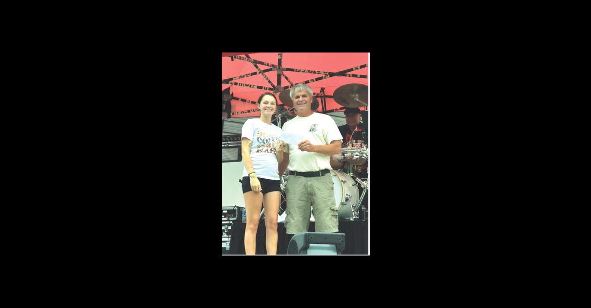 Board member Reese Powers granted funds to the City of Avon, accepted by Mayor Kevin Tjeerdsma. Courtesy Photo