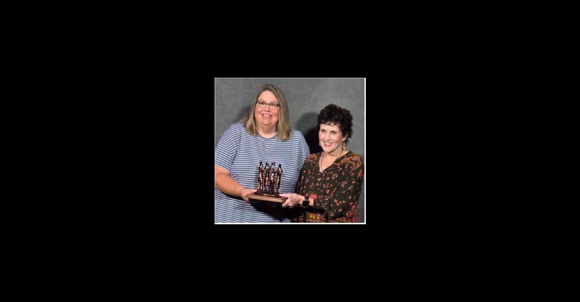 Loretta Knodel and Mary Hurd accepted the Community Helping Hands Award on behalf of the Avon School District and Avon Community Library. COURTESY PHOTO