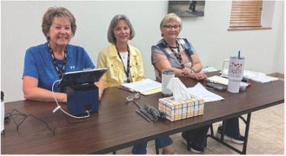 Poll workers were, from left: Vicky Roth, Carol Eggers, and Janet Wormsbecker. Photo by April Powers