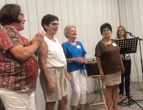 Leading the school song (On Ravinia) were: Karen Anderson, Linda Davies, Carol Kranig, Janet Hrdlicka-Lhotak.
