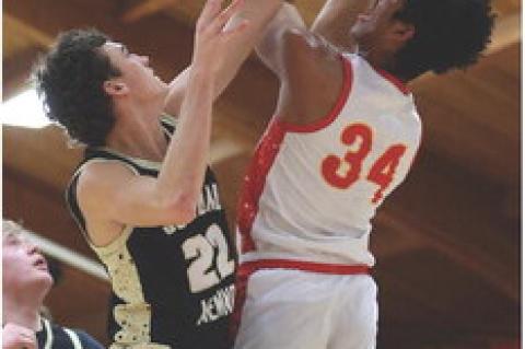 Al'Shamon Gunter drives to the basket for two points. Photos by Barb Pechous