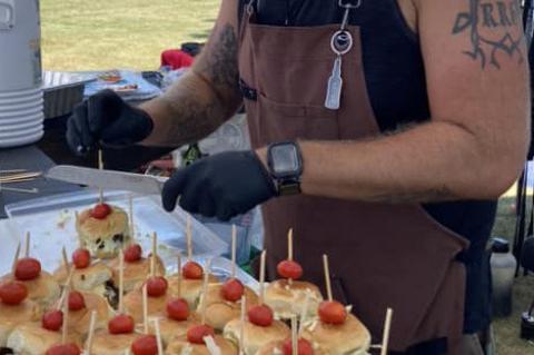 TYLER HOFER REPRESENTS THE LAKE ANDES FIRE DEPARTMENT AT THE ANNUAL FIREMAN’S RIB COOK-OFF IN FREEMAN