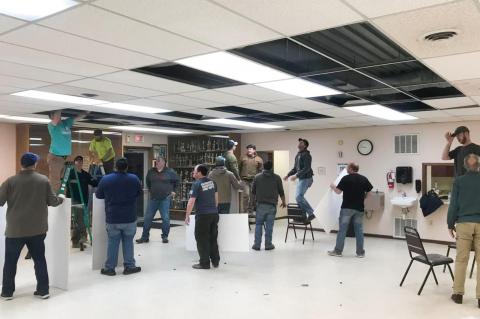 FIREMEN INSTALL CEILING TILES