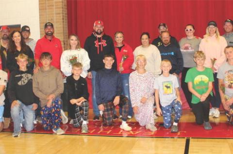 The Avon Pirate Cross Country team was recognized during last week’s Avon volleyball game as part of Parents’ Night. Pictured are, from left: Chad Cooper, Amy Tolsma, Jeff Tolsma, Teanna Kuhlman, Dan Kuhlman, Kenny Podzimek, Whitney Podzimek, Chris Fa