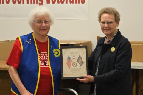 Agnes Nedved receiving her award for 50 years of continuous membership presented by Membership Chairman Barbara Kucera.