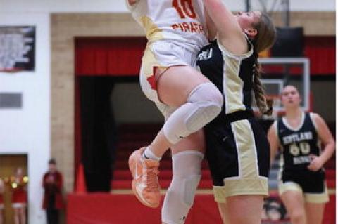 Rilyn Thury goes up over the defense for two points.