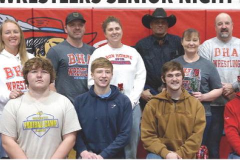 Bon Homme/Avon senior boys wrestlers and their parents were recognized during the Girls Quad last week. Pictured are, from left: Randall Powers (April and Dennis Powers), Caden Zomer (Kara and Travis Zomer), Payton Nielsen (Tabatha and Derek Nielsen), Luk