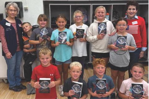 Pictured are, back row from left: Florence Powers (Auxiliary Treasurer,) Brandon Beeson, Esmae Griffith, Kennedy Doom, Lilyanna Odens, Hudsyn Tjeerdsma, Mary Hurd (Auxiliary President); front row: Bowen Beeson, Levi Paulsen, Braxton Schultz, Hadley Cihak.