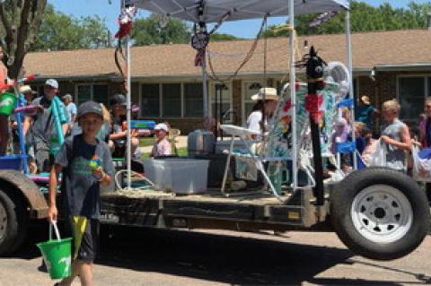 Bon Homme County 4H kids had fun spraying the crowd with water on the hot 100 degree day.