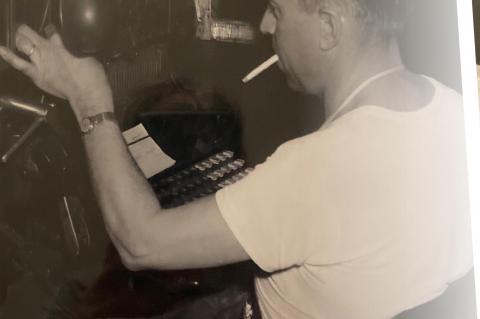 GRANDAUGHTER OF FORMER OWNER OF THE WAVE ENJOYING READING HER PAPER