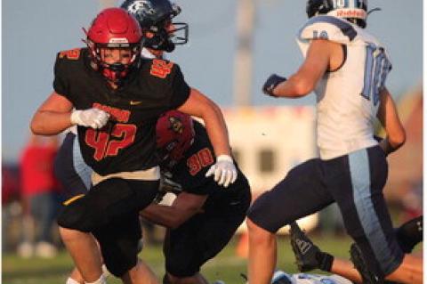 Jacob Ratzlaff moves in for the block.