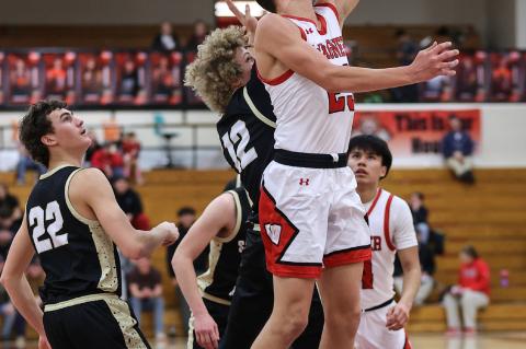 Michael Koupal scores inside despite tight defense.