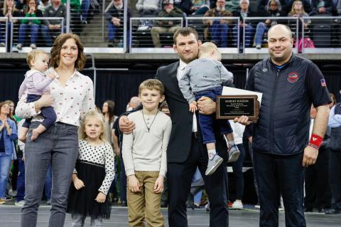 Robert Kokesh with his family at the state wrestling tournament on February 28, where he was inducted into the Hall of Fame. PHOTOS BY BARB PECHOUS | PECHOUS.SMUGMUG.COM