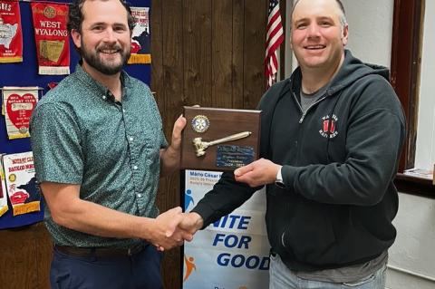Pictured is Jordan Weber receiving a Plaque of appreciation presented by Jamie Soukup for his past year of Presidency.