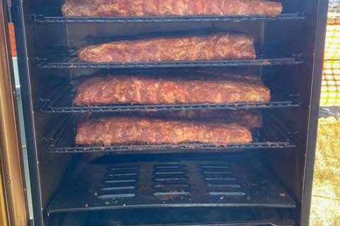 TYLER HOFER REPRESENTS THE LAKE ANDES FIRE DEPARTMENT AT THE ANNUAL FIREMAN’S RIB COOK-OFF IN FREEMAN