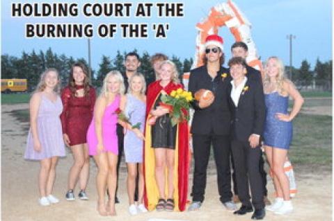 HOLDING COURT AT THE BURNING OF THE 'A'