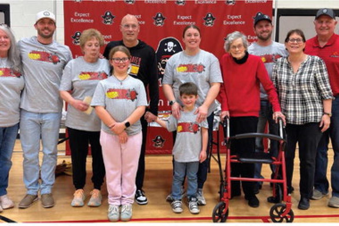 Family members present for the Coach Poppe's reception February 3rd were, back row, from left: Carole Foster, Nick Poppe, Shelly Poppe, Coach Poppe, Megan Heyden, Margaret Poppe, Brand Heyden, Brenda Fathke, and Mel Fathke; front row: Havorly Heyden, and 