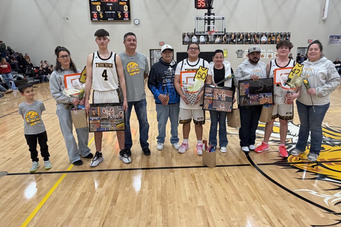 Senior boys basketball players with their parents honored on parents night, pictured from left, are: Isaiah Milk (Elliot Milk and Candace Dvorak), Kashton Garcia (Tracey Garcia and Sandra Tiger), and Takoda Hare (Drew and Amber Avant).