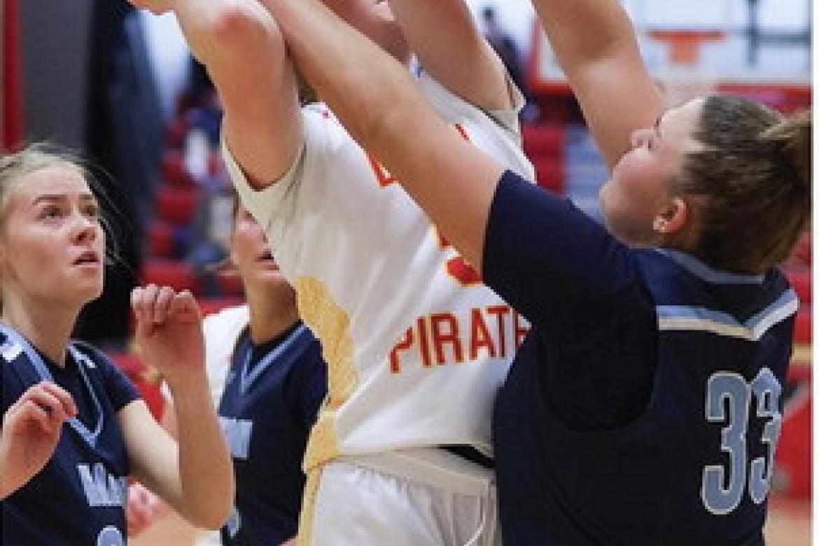 Kaydence Metzger drives in for two points against a tough defensive effort.