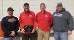 Kevin Vellek is presented with the 2026 Distinguished Lifetime Service Award prior to Bon Homme-Avon wrestling dual with Parkston January 20. On hand for the presentation are from left, Darren Kriz, Bon Homme-Avon wrestling coach, Kevin Vellek; Chris Sayl