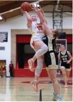 Rilyn Thury goes up over the defense for two points.