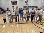 Senior boys basketball players with their parents honored on parents night, pictured from left, are: Isaiah Milk (Elliot Milk and Candace Dvorak), Kashton Garcia (Tracey Garcia and Sandra Tiger), and Takoda Hare (Drew and Amber Avant).