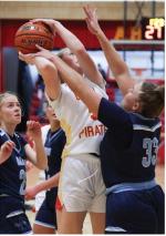 Kaydence Metzger drives in for two points against a tough defensive effort.
